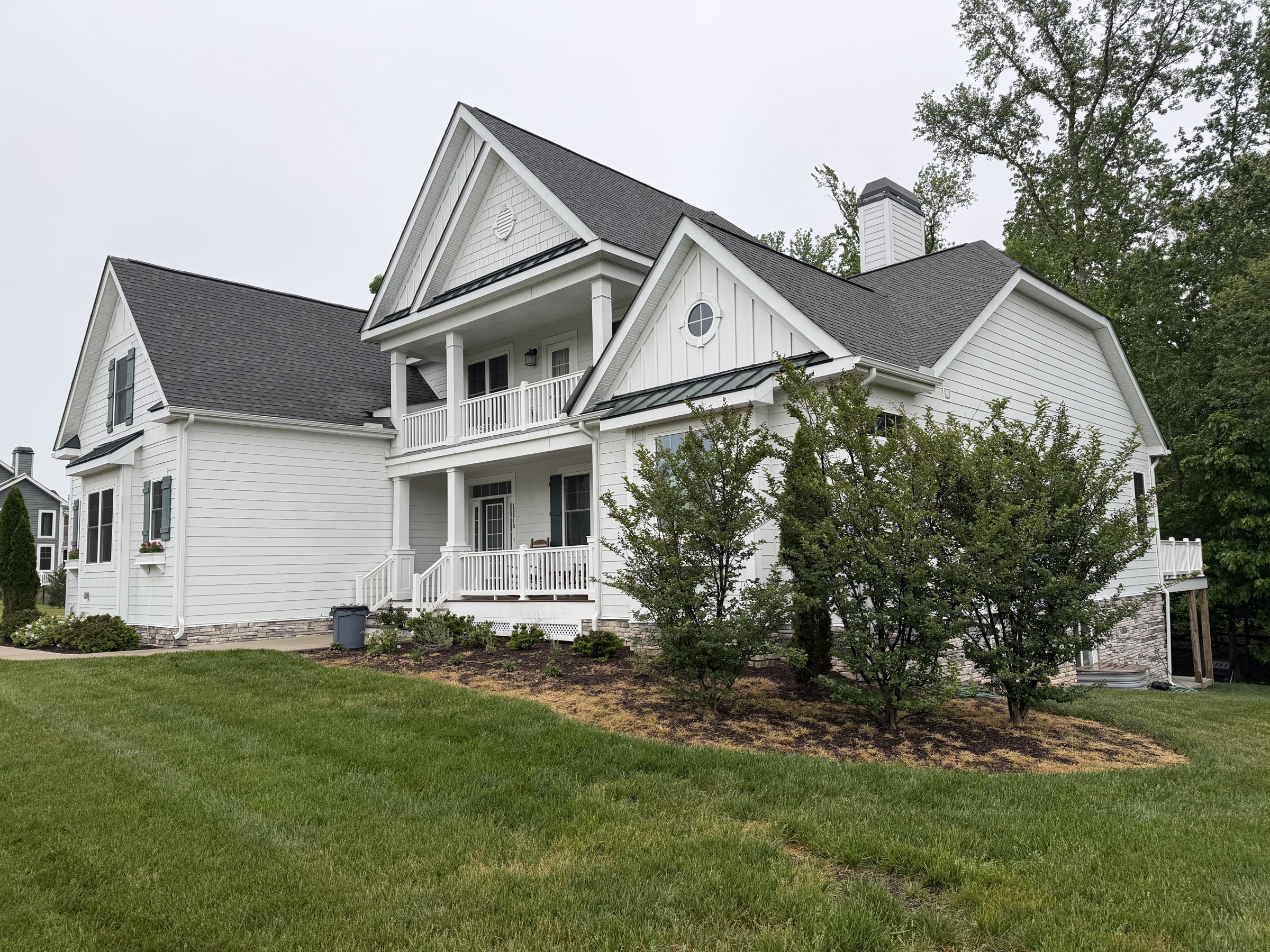 Before: patchy lawn and overgrown foundation shrubs